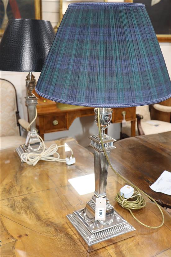 A silver-plated table lamp, with fluted tapered column and urn top and a similar table lamp overall height 72cm